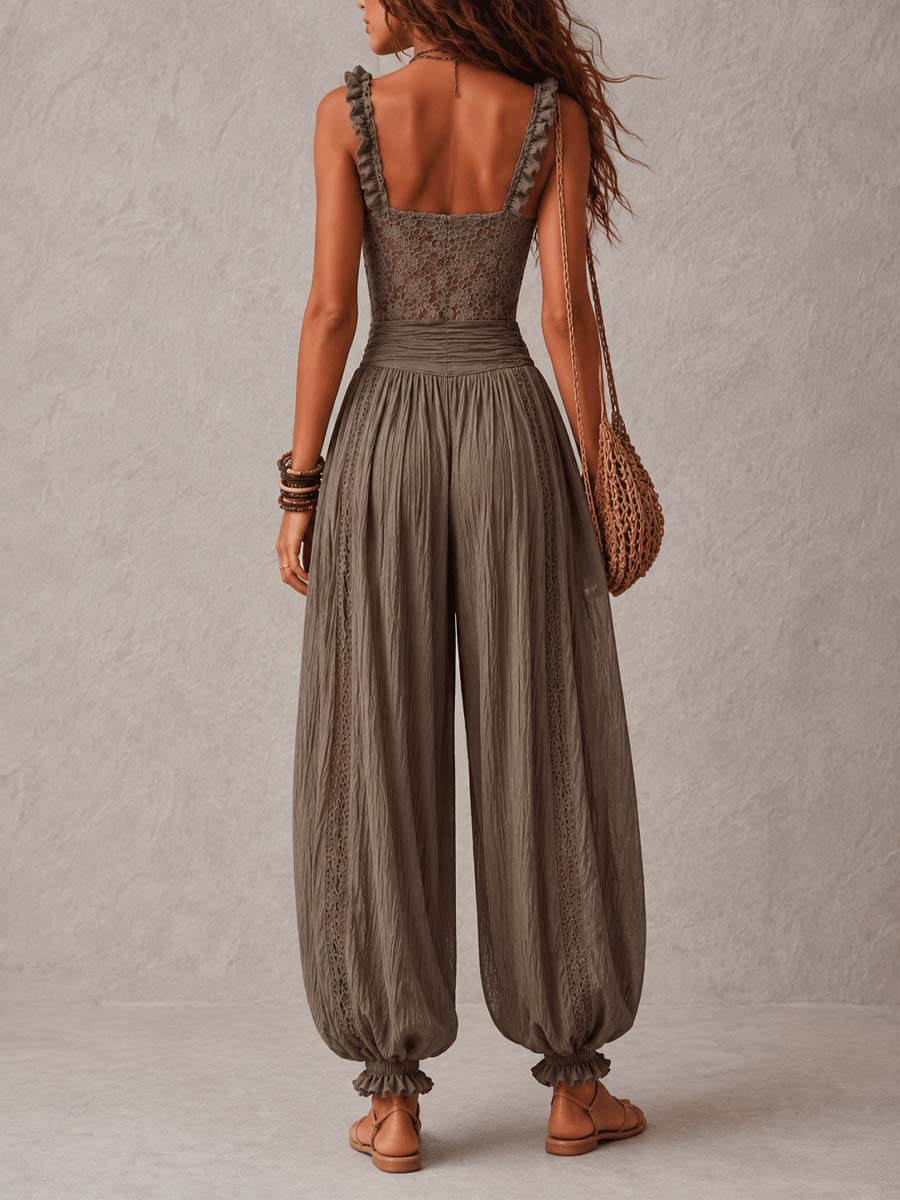 Mono de bandeau de encaje gris y pantalones harem plisados