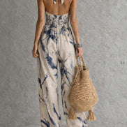 Mono de corte ancho con cuello halter, estampado difuminado y bolsillos