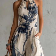Mono de corte ancho con cuello halter, estampado difuminado y bolsillos