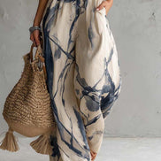 Mono de corte ancho con cuello halter, estampado difuminado y bolsillos