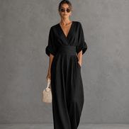 Elegante mono holgado de cuello en V y talle alto.