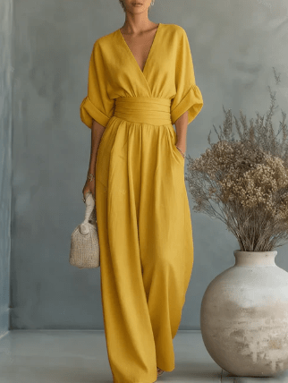 Elegante mono holgado de cuello en V y talle alto.